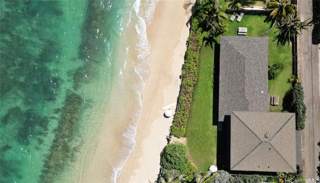 birds eye view of property with a view of the beach and a water view