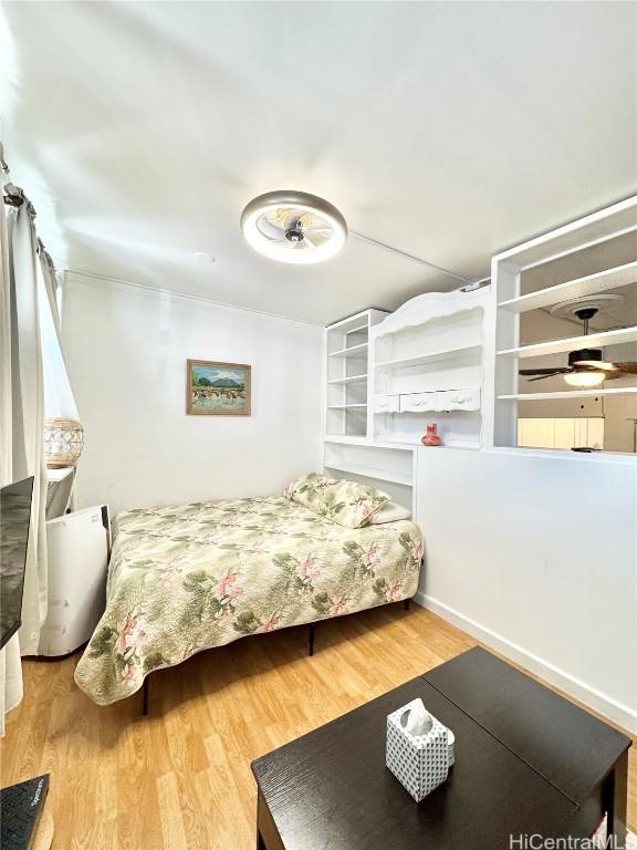 bedroom featuring wood-type flooring