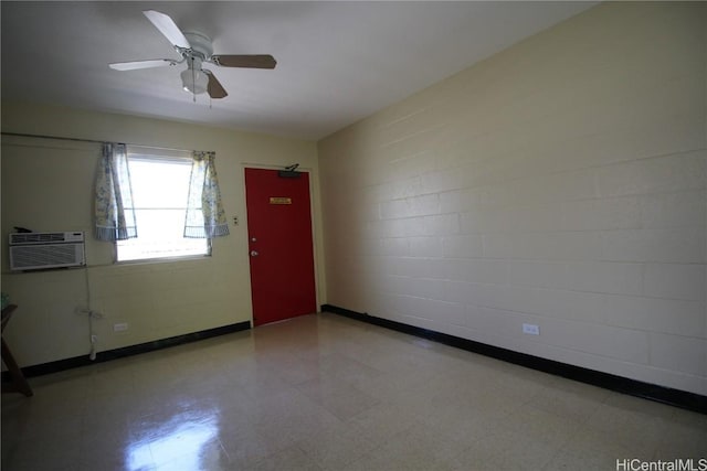 unfurnished room with a wall mounted air conditioner and ceiling fan