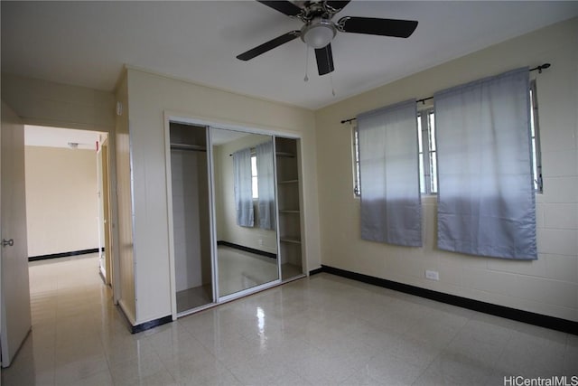 unfurnished bedroom featuring a closet and ceiling fan