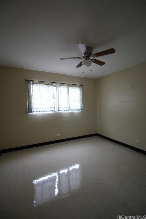 spare room with ceiling fan