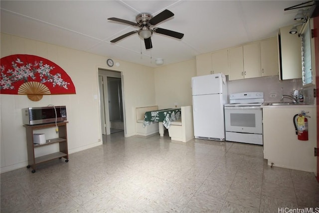 kitchen with ceiling fan, white appliances, sink, and cream cabinets