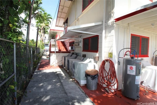 view of property exterior with electric water heater