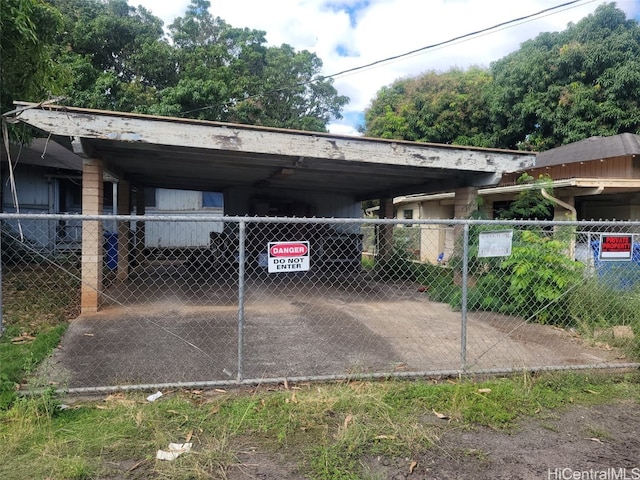 view of vehicle parking featuring a carport