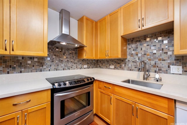 1288 Kapiolani Blvd Unit I-1707, Honolulu, HI 96814 - kitchen with stainless steel electric stove, wall chimney range hood, a sink, and light countertops
