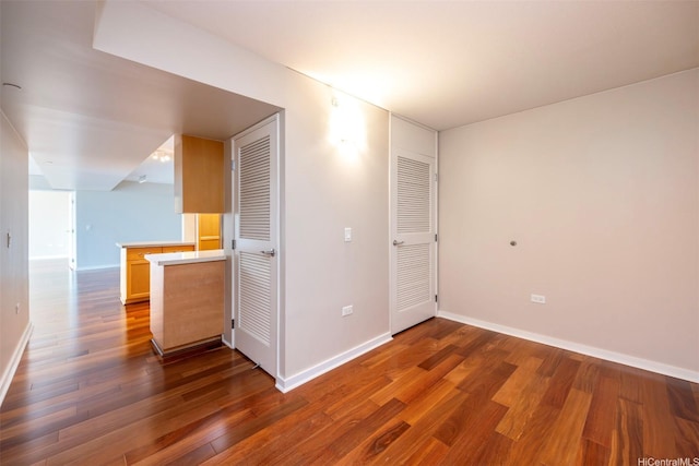 1288 Kapiolani Blvd Unit I-1707, Honolulu, HI 96814 - empty room featuring dark wood-style floors and baseboards