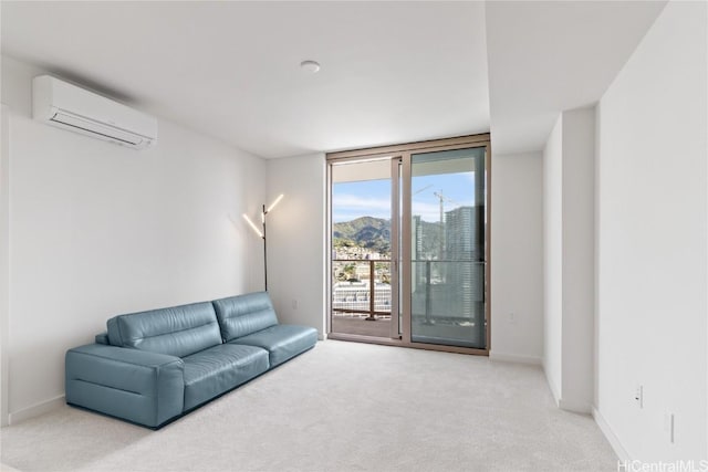 living room with a wall mounted air conditioner, expansive windows, baseboards, and carpet