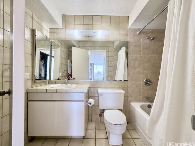 full bathroom featuring tile patterned floors, toilet, tile walls, vanity, and shower / bathtub combination with curtain