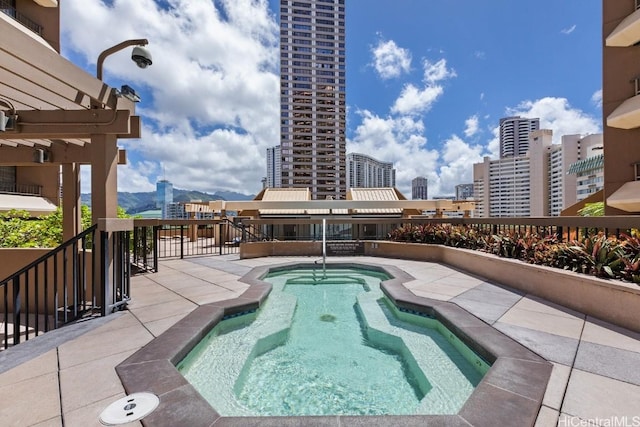 view of pool with a community hot tub