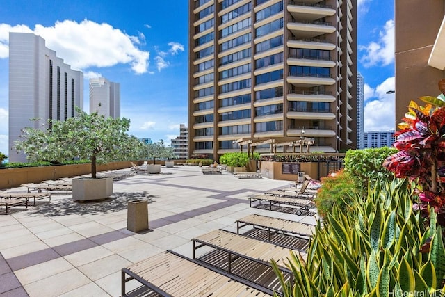 surrounding community featuring a patio