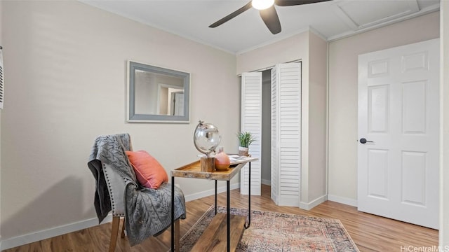 office featuring wood-type flooring, crown molding, and ceiling fan