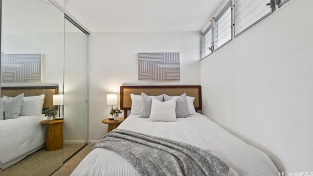 carpeted bedroom with a closet