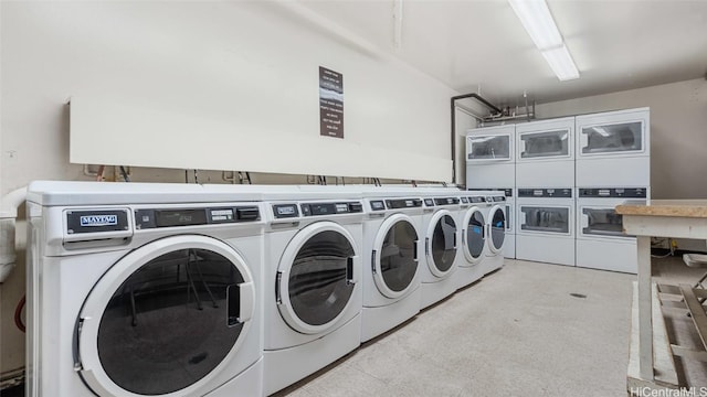 laundry area with independent washer and dryer and stacked washing maching and dryer