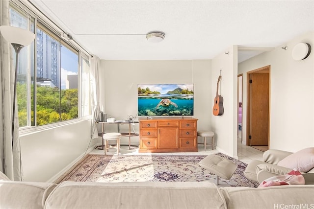 interior space featuring light tile patterned floors and baseboards