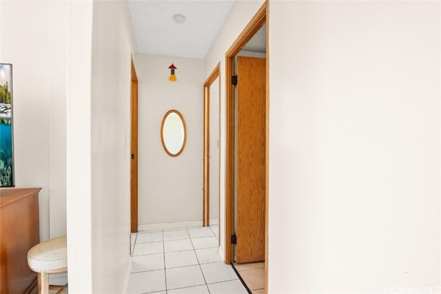 corridor with light tile patterned flooring