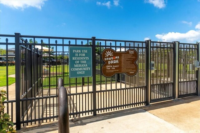 view of gate featuring fence