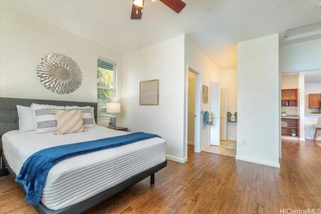 bedroom with wood finished floors, baseboards, and ceiling fan