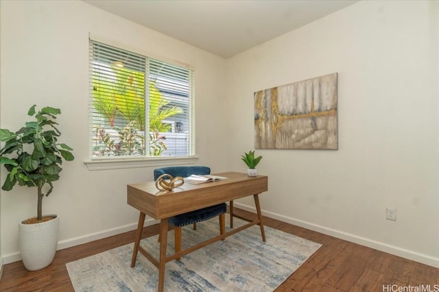 home office with wood finished floors and baseboards