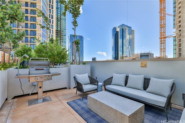 view of patio / terrace featuring a city view and an outdoor hangout area