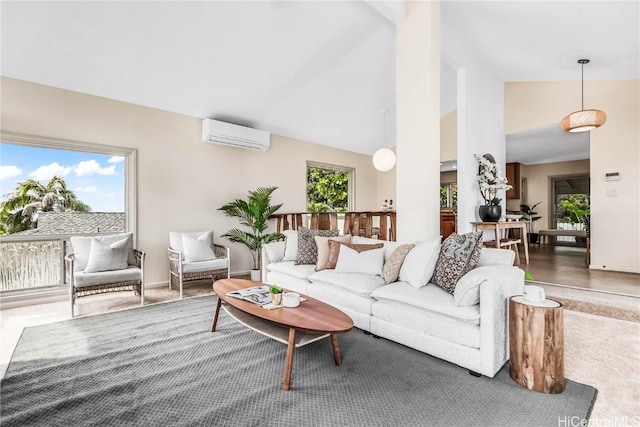 living room with high vaulted ceiling, an AC wall unit, and a wealth of natural light