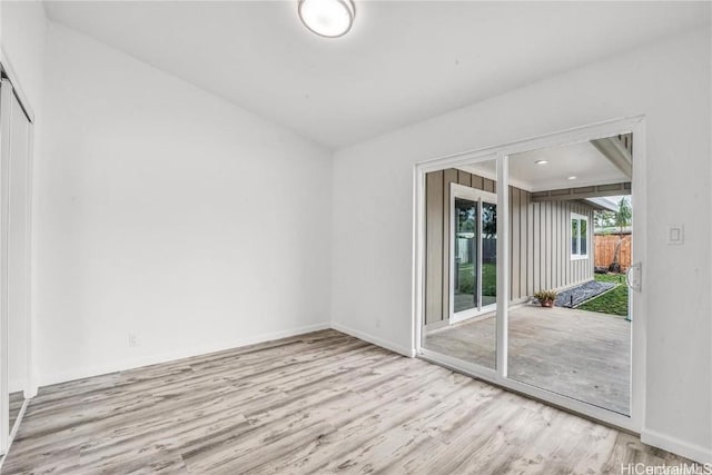 spare room with light wood-type flooring