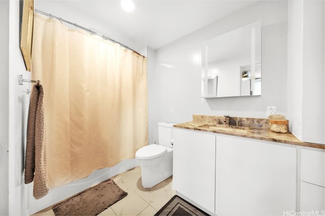 bathroom featuring toilet, shower / tub combo, and vanity