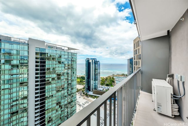 balcony with a view of city and a water view