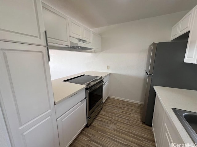 kitchen with white cabinetry, appliances with stainless steel finishes, dark hardwood / wood-style flooring, and sink