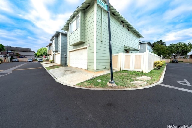 view of side of property with a garage