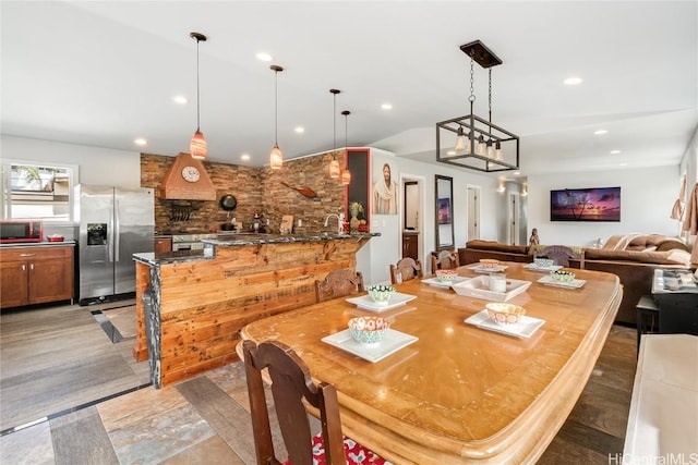 dining space featuring recessed lighting and wet bar