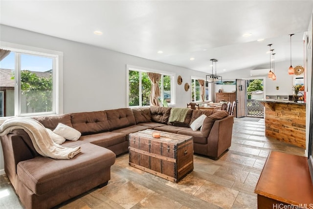 living room with vaulted ceiling and recessed lighting