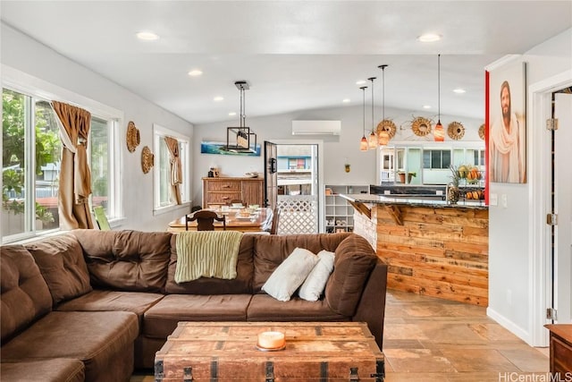 living area featuring vaulted ceiling, an AC wall unit, and recessed lighting