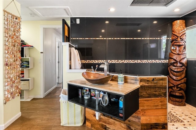 bathroom featuring recessed lighting, wood finished floors, vanity, visible vents, and baseboards