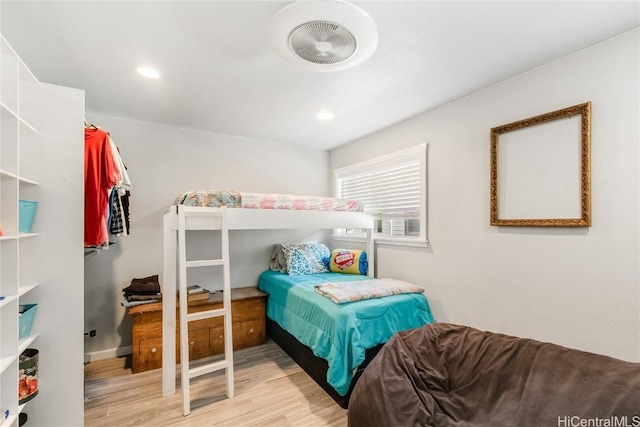 bedroom featuring wood finished floors and recessed lighting