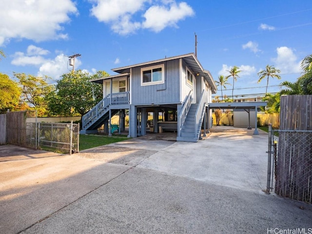 view of front of property with a carport and a porch