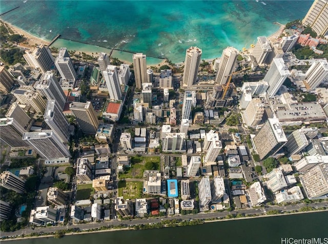 birds eye view of property with a water view and a view of city