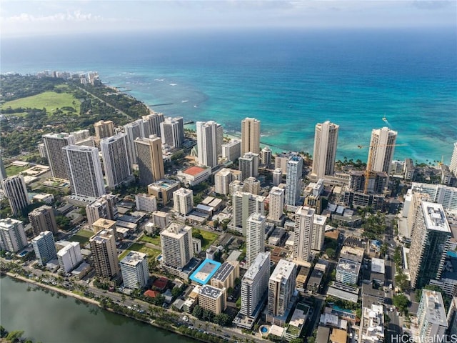 birds eye view of property featuring a view of city and a water view