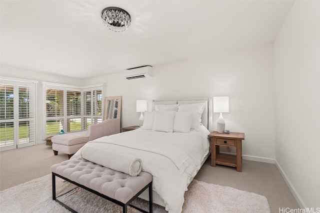 bedroom featuring access to exterior, carpet, a wall unit AC, and baseboards