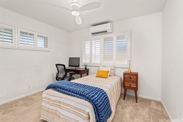 bedroom featuring carpet, a wall mounted air conditioner, ceiling fan, and baseboards