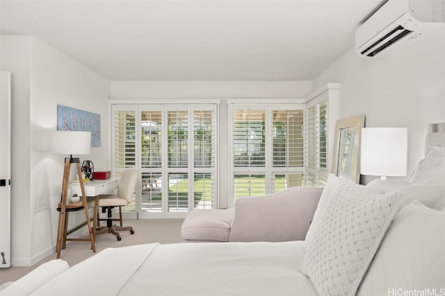 carpeted bedroom featuring a wall mounted AC