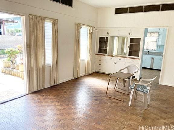 kitchen with white cabinetry and baseboards