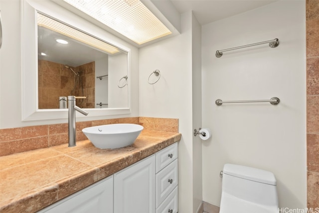 bathroom with toilet and vanity