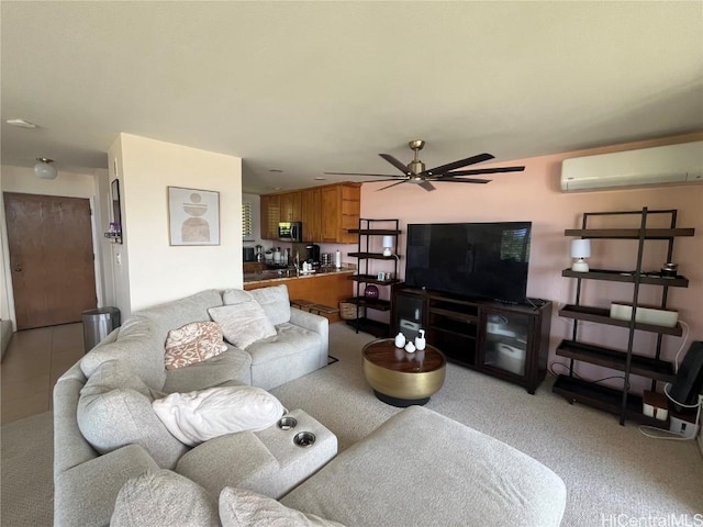 living room with ceiling fan and a wall mounted AC