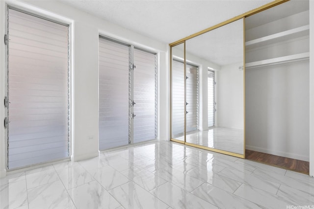 1617 Keeaumoku St Unit 1405, Honolulu, HI 96822 - unfurnished bedroom featuring marble finish floors
