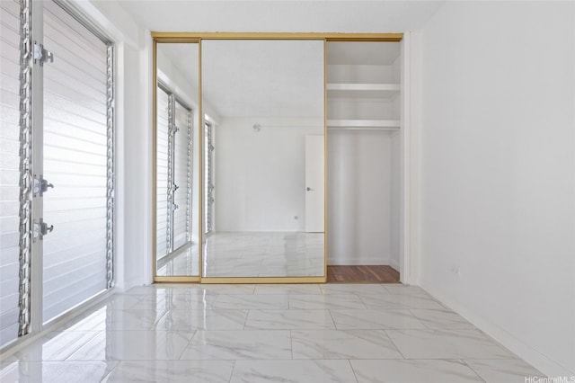 1617 Keeaumoku St Unit 1405, Honolulu, HI 96822 - unfurnished bedroom with marble finish floors and a closet