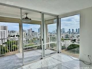 1617 Keeaumoku St Unit 1405, Honolulu, HI 96822 - entryway featuring a view of skyline and a wall of windows