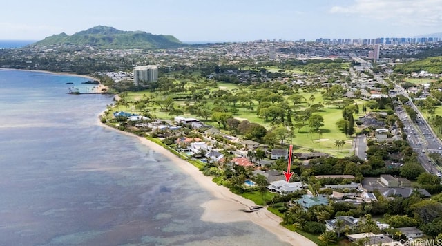 birds eye view of property with a view of the beach, a water view, and a city view