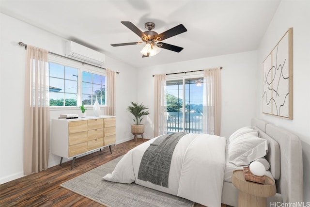 bedroom with a ceiling fan, baseboards, access to outside, a wall mounted AC, and dark wood finished floors