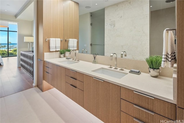 bathroom featuring tile walls and vanity