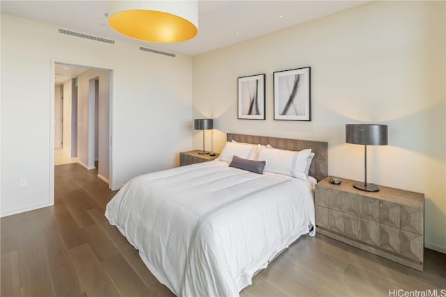 bedroom with hardwood / wood-style flooring